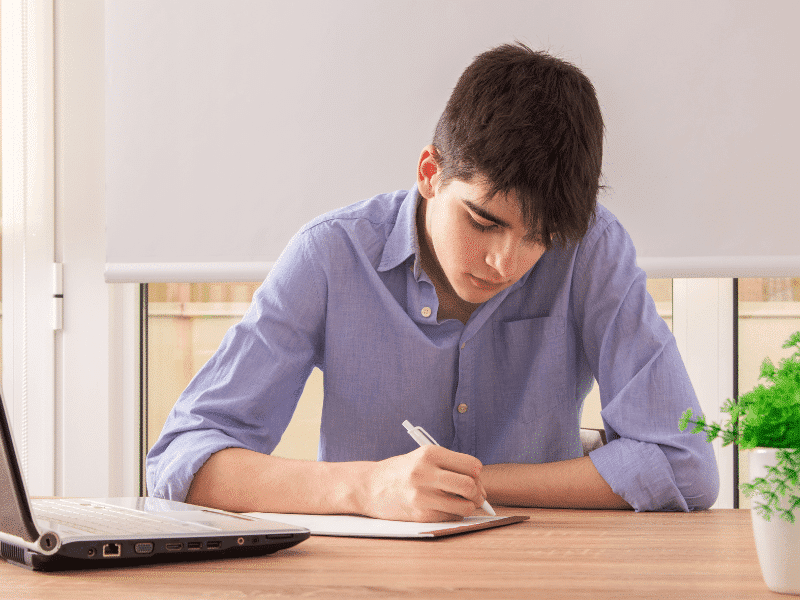 High School Student writing essay