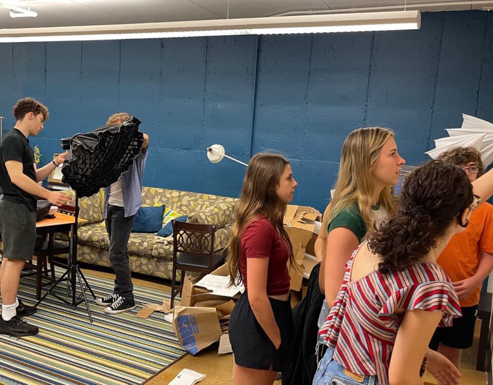 Young adults filming in Gorton Center Alcove