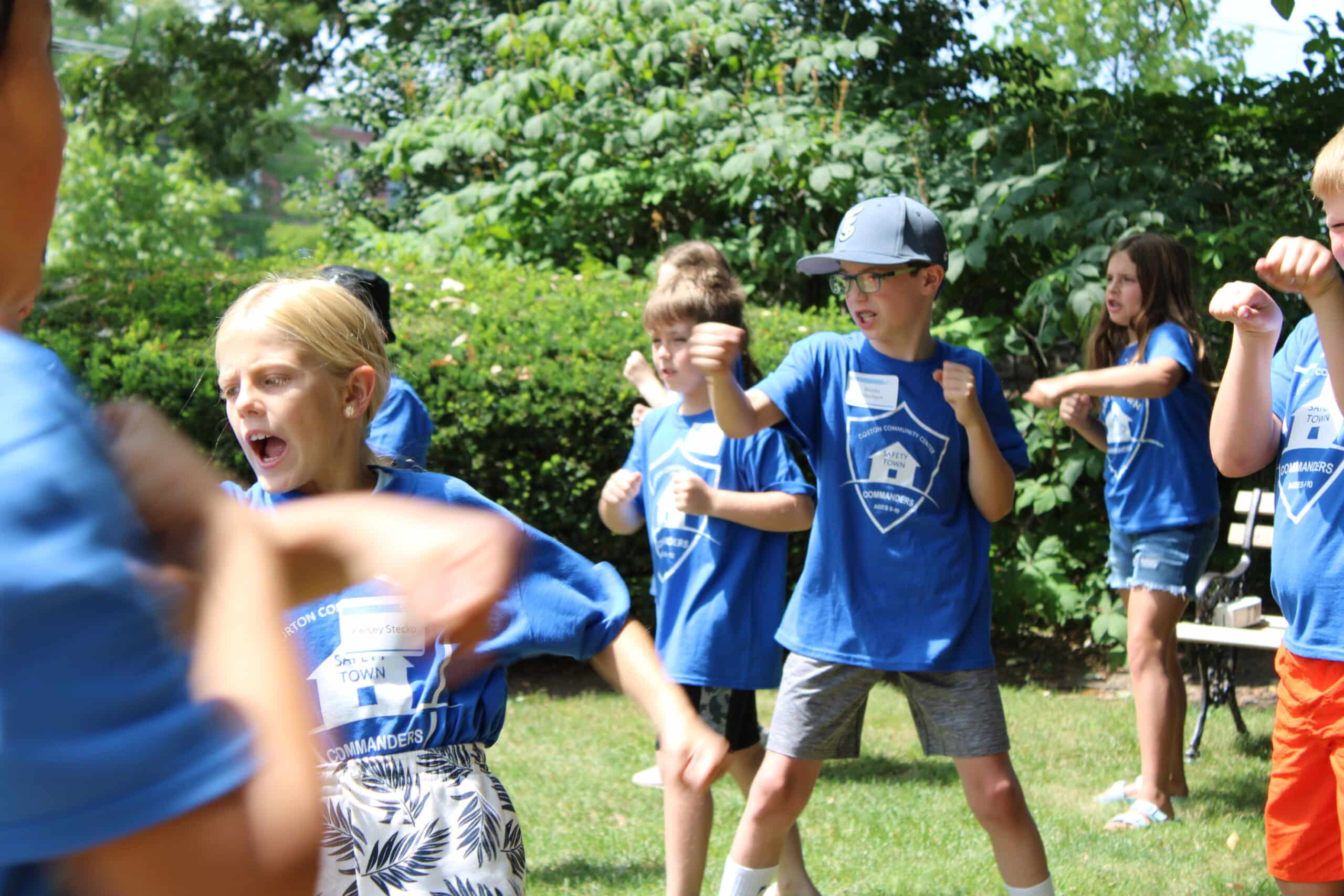 kids practicing self-defense in blue t-shirts at Gorton