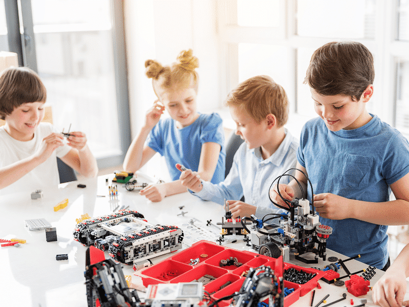 Students working with artificial intelligence in robotics STEM camp